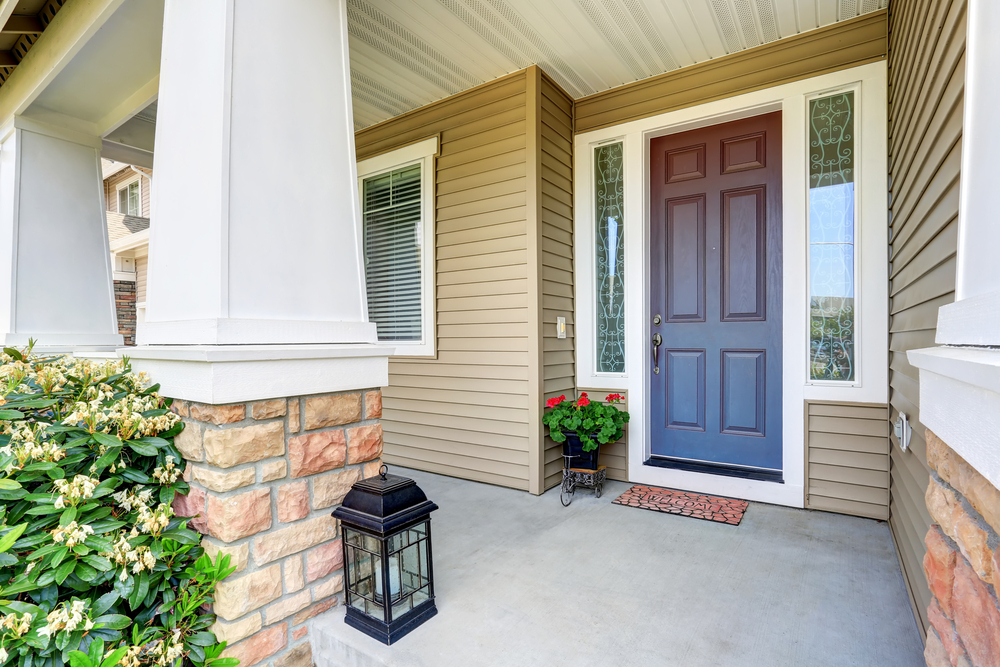 Front,Entry,Door,With,Concrete,Floor,Porch,And,Flowers,Pot.