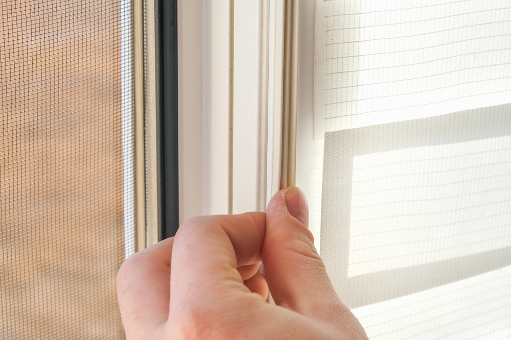 The,Man,Wipes,The,Window,Frame,With,A,Degreaser,And