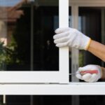 Handyman,Repairing,The,Sliding,Window.,Adjust,A,Rail,Wheel,And